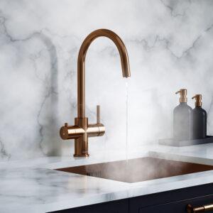 a brushed copper swan neck boiling water tap