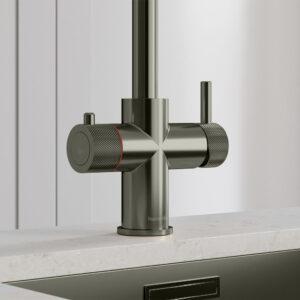 Close-up of a gunmetal grey instant hot tap handle