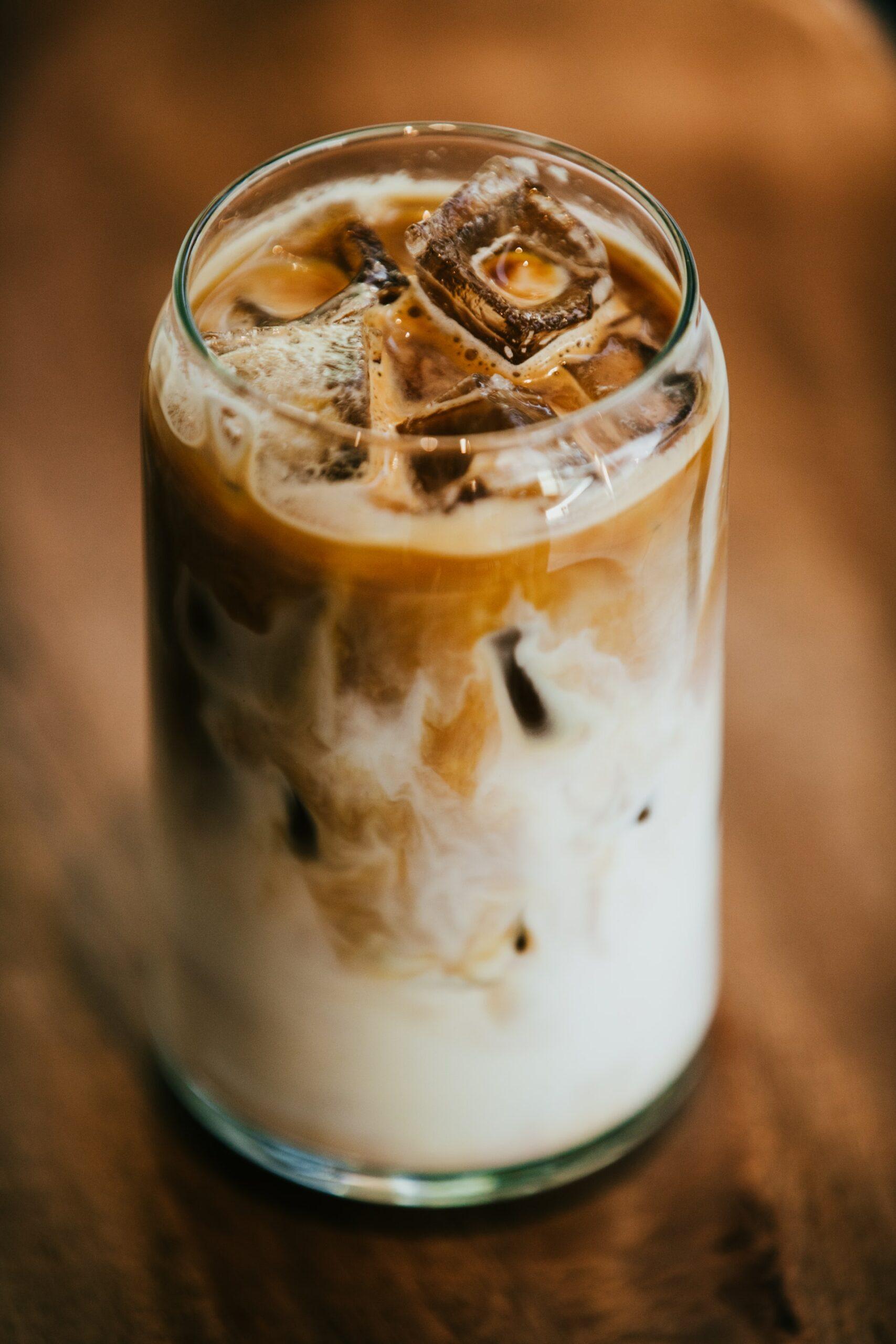 clear glass filled with iced coffee