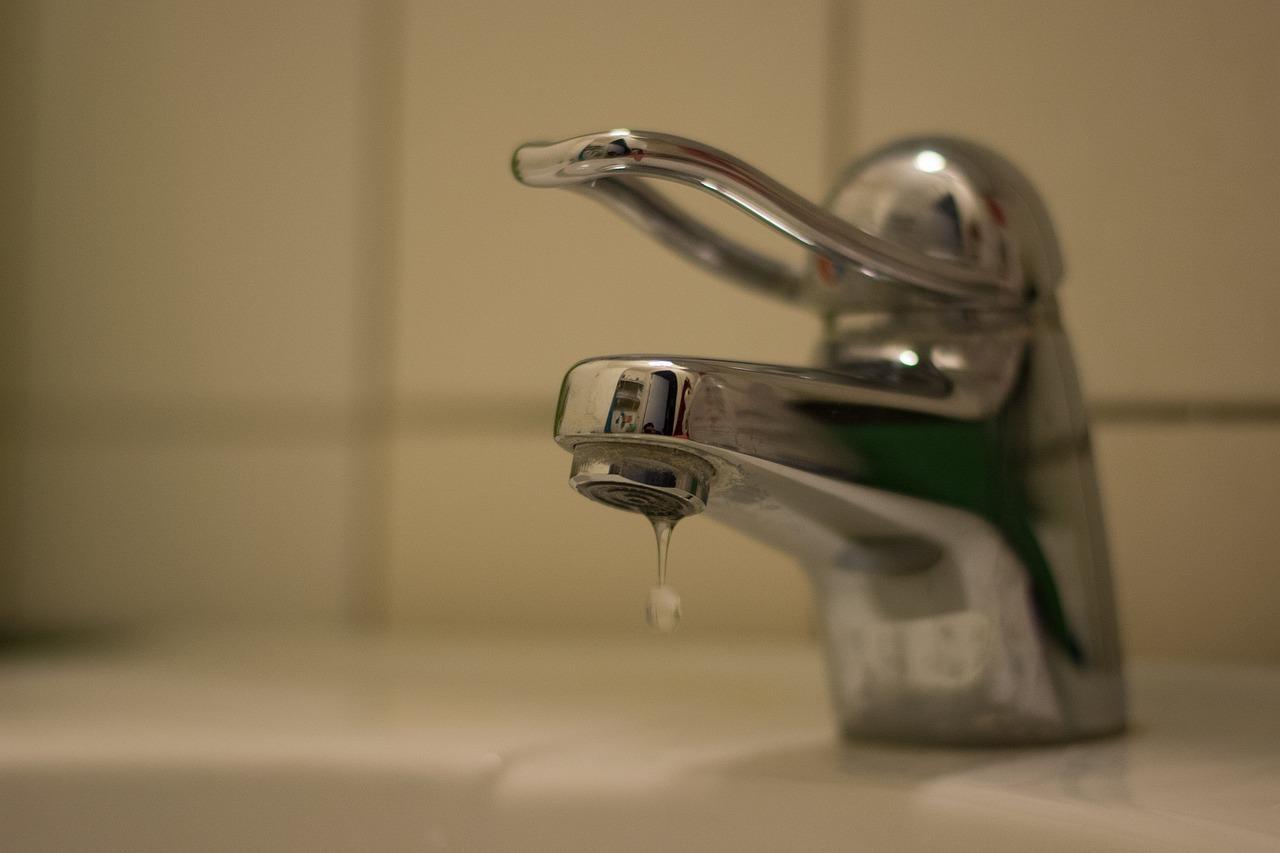 a dripping tap inside a bathrom