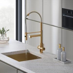 a brushed gold flexible pull-out spray hot water tap
